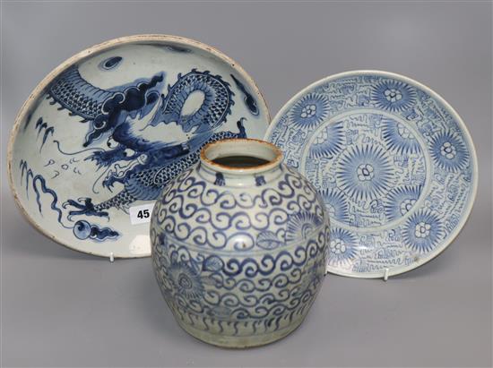 A Chinese blue and white deep plate decorated with a dragon and two other items